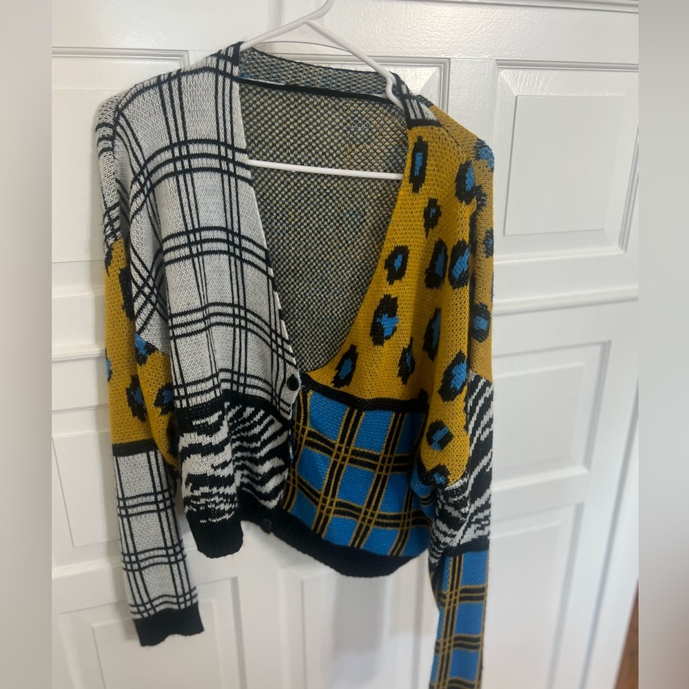 Lightweight multi color mixed print plaid & animal print cardigan sweater.